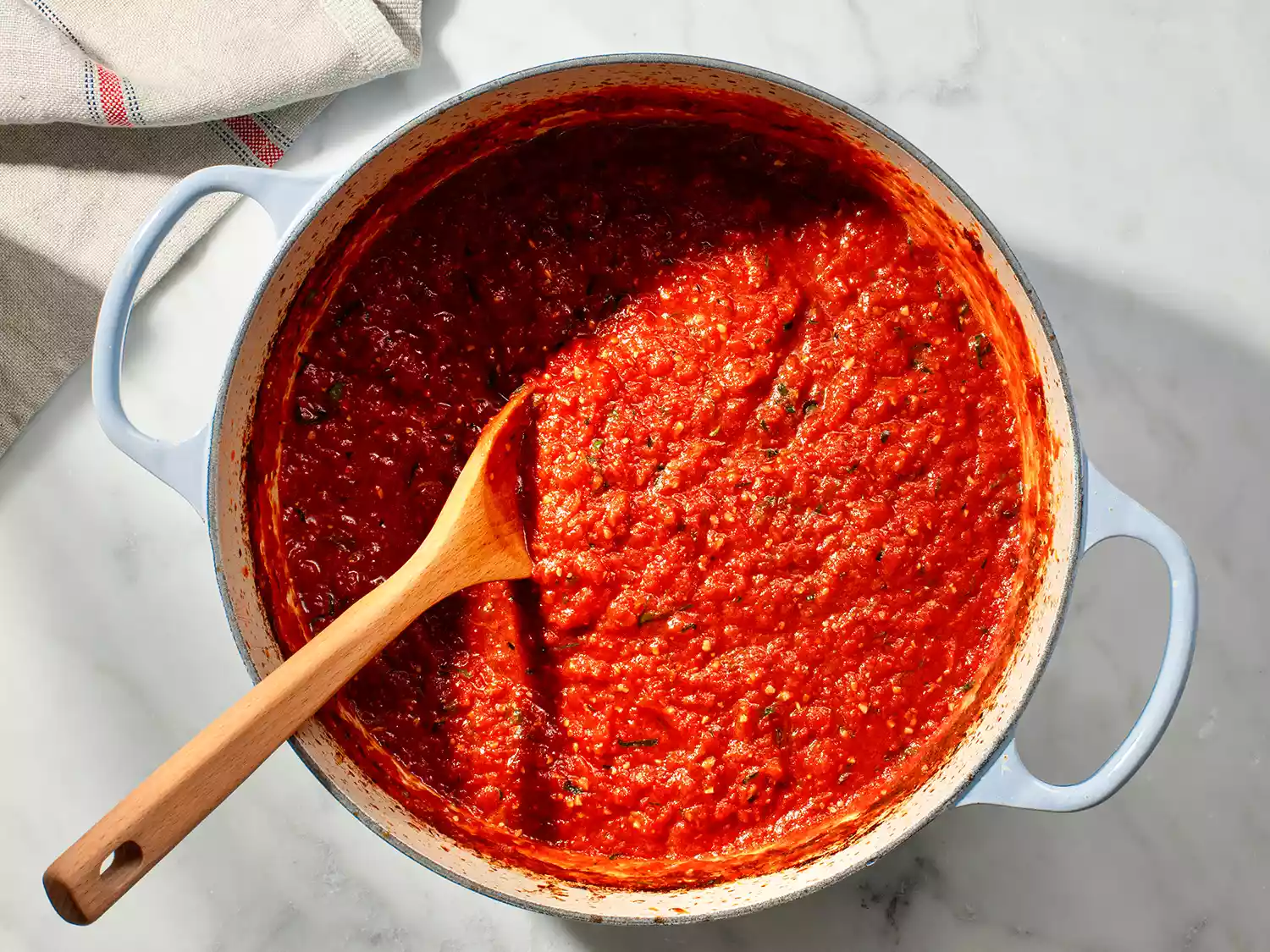 slow-cooked red sauce in a Dutch oven